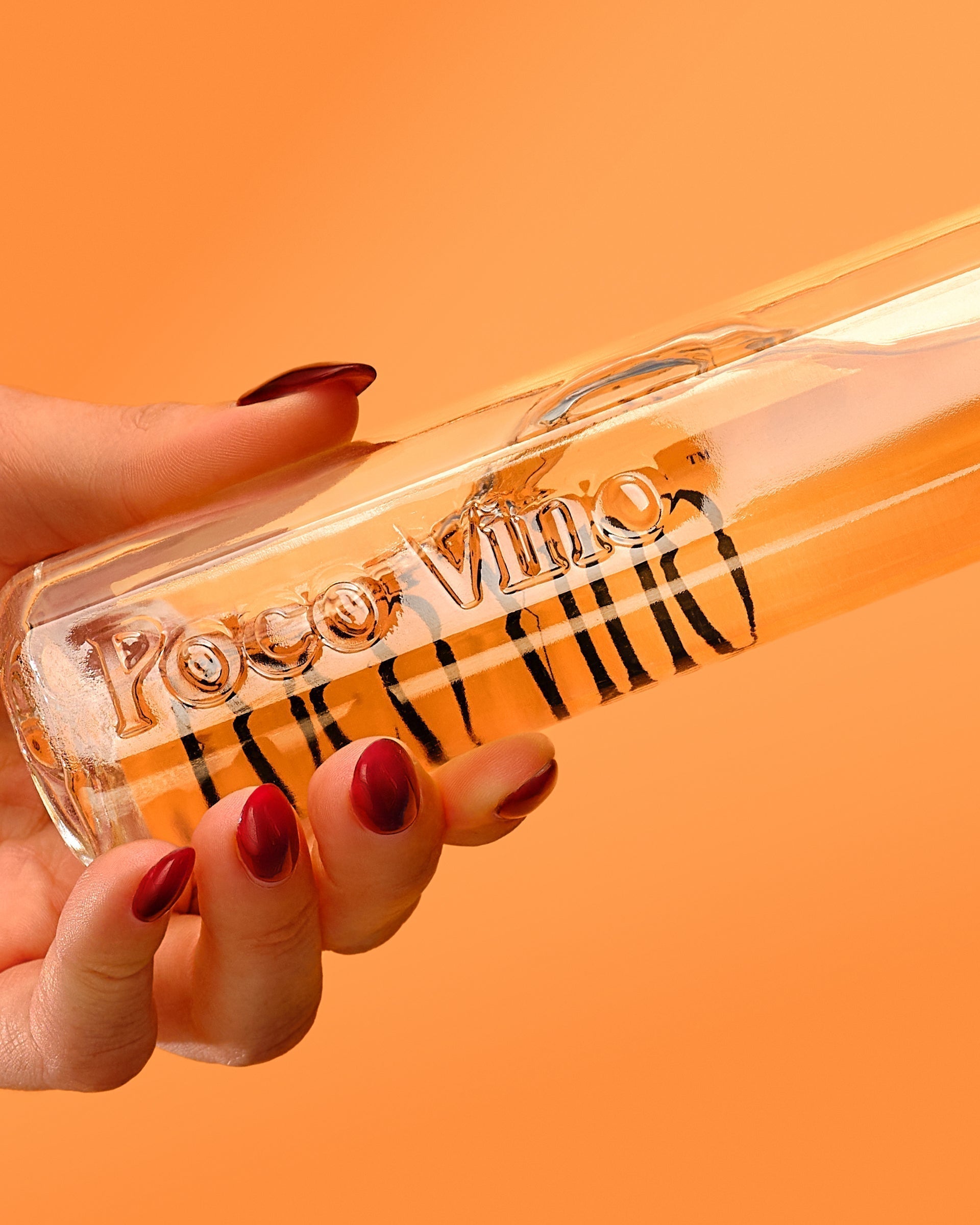 Poco Vino Chardonnay Close up bottle shot with orange background